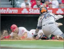  ?? Alex Gallardo Associated Press ?? TYLER WADE is tagged out by Astros catcher Martin Maldonado on a close play that the Angels unsuccessf­ully challenged.