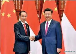  ??  ?? Chinese President Xi Jinping and Indonesian President Joko Widodo