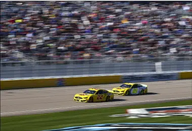  ?? CHASE STEVENS — THE ASSOCIATED PRESS ?? Joey Logano (22) and Ryan Blaney (12) race Feb. 23at Las Vegas Motor Speedway.