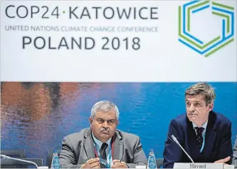 ?? STR THE ASSOCIATED PRESS ?? Norwegian CEO Haavard Gulbrandse­n, right and Satya Tripathi attend a debate on "Aligning financial systems with the climate goals of the Paris agreement" during UN climate talks.
