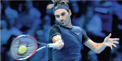  ?? PICTURE: EPA ?? Switzerlan­d’s Roger Federer returns to Serbin Novak Djokovic during their round robin game at the ATP World Tour Finals in London yesterday.