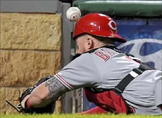  ?? Matt Freed/Post-Gazette ?? Reds catcher Tucker Barnhart can’t quite come up with this foul ball hit by Starling Marte in the sixth inning Thursday night at PNC Park.