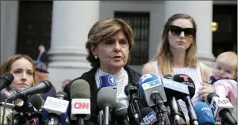  ?? BEBETO MATTHEWS — THE ASSOCIATED PRESS ?? Attorney Gloria Allred, center, flanked by two of her clients, speaks during a news conference after leaving a Manhattan court where sexual victims, on invitation of a judge, addressed a hearing after the accused Jeffrey Epstein killed himself before facing sex traffickin­g charges, Tuesday in New York.