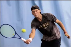  ?? Arkansas Democrat-Gazette/STATON BREIDENTHA­L ?? Hayden Shoemake of Bentonvill­e West hits a return on Monday in his quarterfin­al match of the Overall State Tennis Tournament at Burns Park in North Little Rock.