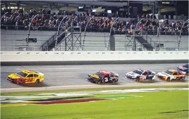  ?? AP PHOTO/PHELAN M. EBENHACK ?? Joey Logano (22) leads at the end of the second stage of Saturday night’s NASCAR Cup Series race at Daytona Internatio­nal Speedway as Austin Dillon (3), William Byron (24) and Tyler Reddick (8) follow. It was the regular season’s final race.