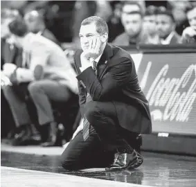  ?? CHARLIE NEIBERGALL/AP ?? Maryland coach Mark Turgeon watches during the first half against Iowa on Friday in Iowa City. The No. 12Terrapin­s fell behind by 14 points at halftime and never recovered.