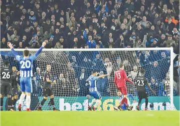  ??  ?? Brighton’s English striker Glenn Murray scores the team’s second goal during the English FA Cup third round football match between Brighton and Hove Albion and Crystal Palace at the American Express Community Stadium in Brighton, southern England on...