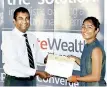  ??  ?? First of three winners for the inaugural NDB Wealth ‘It’s Time’ Challenge Lonali Rodrigo (right) with NDB Wealth CEO Prabodha Samaraseke­ra