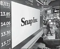  ?? AP/RICHARD DREW ?? The Snap Inc. logo appears on a screen above a trading post on the floor of the New York Stock Exchange earlier this month.