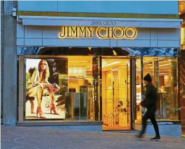  ??  ?? Famous shoemaker: A JImmy Choo store in the mountain resort of St. Moritz, Switzerlan­d. The Jimmy Choo brand rose to prominence in the late 1990s, boosted by high-profile personalit­ies. – Reuters