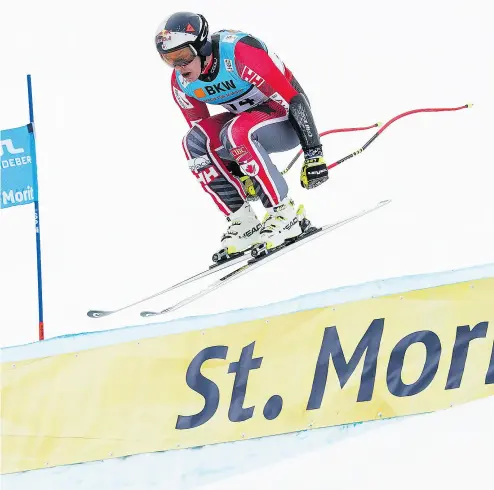  ?? GIAN EHRENZELLE­R / KEYSTONE VIA THE ASSOCIATED PRESS ?? Canada’s Erik Guay, 35, speeds down the course during the men’s super- G race at the Alpine Skiing World Championsh­ips in St. Moritz, Switzerlan­d, on Wednesday. Guay won gold just 12 days after a harrowing crash in Germany.