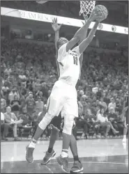  ?? NWA Democrat-Gazette/BEN GOFF • @NWABENGOFF ?? Arkansas forward Daniel Gafford (10) goes up for a dunk against Fresno State on Friday at Bud Walton Arena in Fayettevil­le.