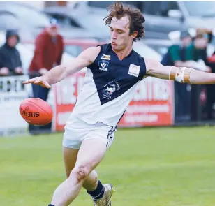  ??  ?? Above: Bunyip’s Mathew Miller leads in the race for the ball, with teammates Jeb McLeod and Dean Fitzgerald giving chase along with Nar Nar Goon opponents Kris Fletcher and Clint Williams
Left: Nar Nar Goon’s Josh Grant boots the ball into...