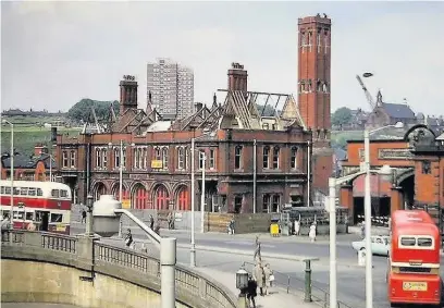  ??  ?? ●Stockport’s old fire station in Mersey Square was dismantled in 1967- on the skyline are the newly built flats on Dodge Hill