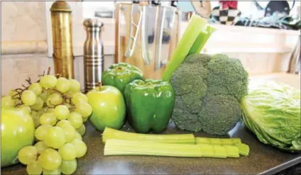  ?? PHOTOS BY MICHILEA PATTERSON — DIGITAL FIRST MEDIA ?? A variety of green fruits and vegetables are on display. Celebrate St. Patrick’s Day by eating healthy green foods, many of which are “superfoods” that contain lots of nutrients.