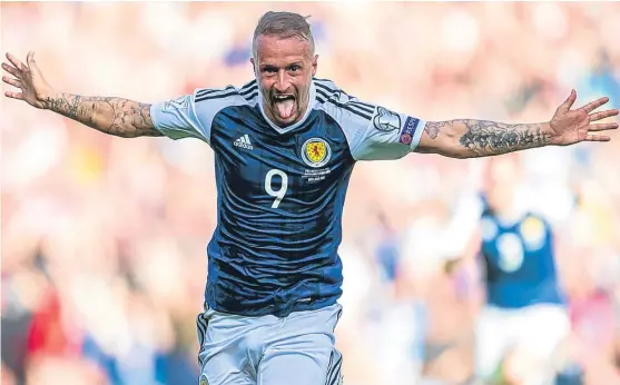  ?? Picture: SNS Group. ?? Leigh Griffiths celebrates the first of his two goals against England at Hampden Park on Saturday.