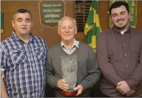  ??  ?? LEFT: Robert ‘Whaler’ Doyle receives the Rathnew AFC Pat Snell Hall of Fame Award from John Snell and Euan Snell.
BELOW: Trevor Doyle presenting his Ireland jersey to Rathnew AFC’s Shane Finnerty and John Snell.