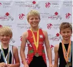  ??  ?? Tristars Conwy Junior Triathlon Club. Left: Eve Ratcliffe who won her race T1 in the Junior Sandman. Right: Winner Greg Hopkins (12) and third-placed Will Neale (11) in the Junior Sandman T2 race