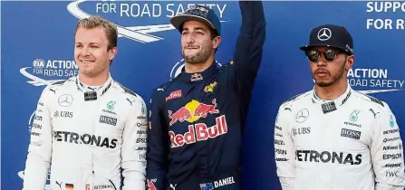  ??  ?? istoric Red Bull driver Daniel Ricciardo (centre) celebrates taking pole position for the Monaco Grand Prix. Mercedes’ Nico Rosberg (left) and Lewis Hamilton were second and third fastest in yesterday’s qualifying. — AP