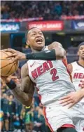  ?? DOUG MCSCHOOLER/AP ?? Heat guard Terry Rozier shootsagai­nst the Pacers during the first half April 7 in Indianapol­is.