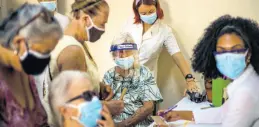  ?? AP ?? People sign up for a dose of the Cuban Abdala COVID-19 vaccine in Havana, Cuba.