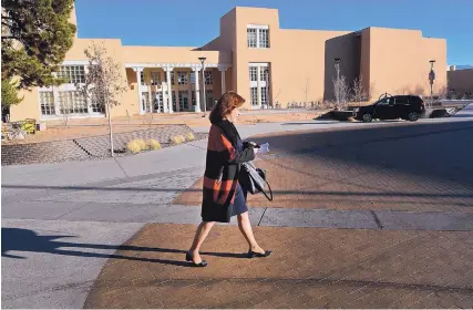  ?? JIM THOMPSON/JOURNAL ?? University of New Mexico President Garnett Stokes walks along Smith Plaza on campus while heading to a meeting at the Student Union Building.