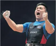  ??  ?? Weightlift­er Pornchai Lobsi celebrates winning the men’s 85kg gold medal.