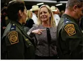  ?? ALEX WONG / GETTY IMAGES ?? Homeland Security Secretary Kirstjen Nielsen (center) greets U.S.Border Patrol members after an event Friday in Washington.