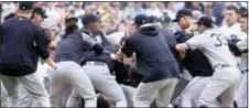  ?? DUANE BURLESON — THE ASSOCIATED PRESS ?? Detroit’s Miguel Cabrera is in the bottom of the pile as the Yankees fight with the Tigers during the sixth inning Thursday in Detroit.