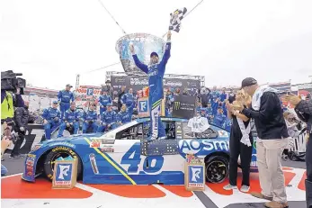  ?? WADE PAYNE ASSOCIATED PRESS ?? Driver Jimmie Johnson celebrates his NASCAR win at Bristol on Monday. Johnson has not had good fortune at the Tennessee track, but he managed to earn his 82nd career victory.