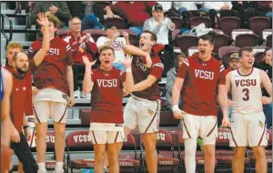  ?? Clara Wieland/ VCSU ?? VCSU's bench celebrates a big play Friday night.