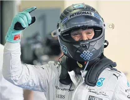  ??  ?? Mercedes driver Nico Rosberg celebrates after topping the qualifying session at the Yas Marina circuit in Abu Dhabi.