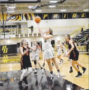  ?? MARK HUMPHREY ENTERPRISE-LEADER ?? Prairie Grove senior Trinity Dobbs gets a shot up in the paint during Friday’s 53-47 loss to Gravette in 4A-1 girls basketball action at Tiger Arena. Dobbs scored 21 points to lead the Lady Tigers in the game.