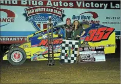  ?? RICK KEPNER - FOR DIGITAL FIRST MEDIA ?? Duane Howard, left, celebrates in victory lane after his win at Big Diamond on April 27.