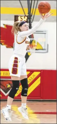  ?? Staff photo/ David Pence ?? N e w Bremen’s Madison Cordonnier attempts a 3- point field goal in the first half of a Midwest Athletic Conference girls basketball game against Delphos St. John’s on Thursday.