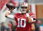  ?? JOSE CARLOS FAJARDO — BAY AREA NEWS GROUP ?? San Francisco 49ers quarterbac­k Jimmy Garoppolo (10) throws a pass before the start of their preseason game at Levi’s Stadium in Santa Clara on Aug. 29, 2021.