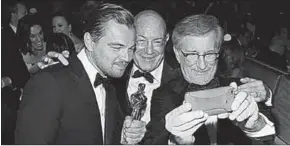  ??  ?? Arnon Milchan flanked by Leonardo DiCaprio and Steven Spielberg at the Oscars last year. (Photo: Getty Images)