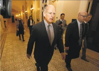  ?? Rich Pedroncell­i / Associated Press ?? Gov. Jerry Brown soon will have to decide whether to sign SB54, the sanctuary state bill that won approval in the state Senate and is now in the Assembly, where it is expected to pass.