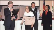  ?? Doug Walker / RN-T ?? City Commission­er Randy Quick (from left) reads a proclamati­on honoring the late Sam Burrell. Burrell’s widow Josephine Burrell was on hand along with Sam Burrell Jr. and Edna English.