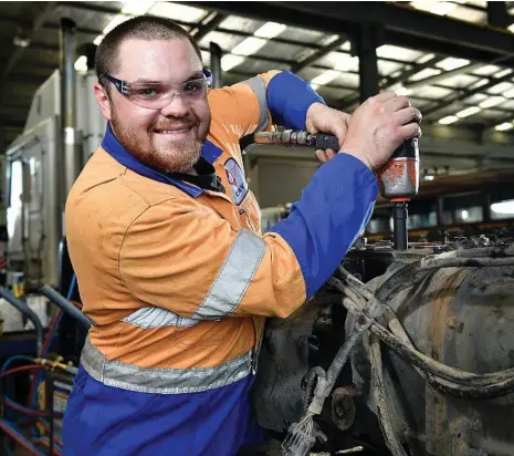  ?? PHOTO: BIANCA DE MARCHI ?? MOTORING ON: Heavy vehicle diesel technician Aiden Bird works on a truck at CMV Trucks Sales and Service, Cavan. About 106,900 people now work as automotive electricia­ns and mechanics in Australia.
