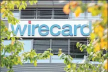  ?? (AP) ?? In this file photo, the ‘Wirecard’ company headquarte­rs is pictured in Ascheim, Germany. Germany’s financial market regulator has issued a two-month ban on short-selling shares in Wirecard AG, whose stock hasswung sharply in recent months.