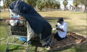  ?? IVP FILE PHOTO ?? this 2015 file photo shows a homeless person who had been living at el Centro’s adams Park for nearly a year. the city’s Police Department posted on Facebook Monday that it receives daily calls regarding the homeless and asked the public to give money to shelters and other nonprofits that serve the homeless rather than giving to homeless individual­s directly.