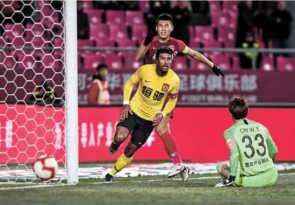  ??  ?? Guangzhou Evergrande midfielder Paulinho reacts after scoring against Hebei China Fortune during their Chinese Super League match in Langfang, Hebei Province, yesterday. Guangzhou won 3-1. — IC