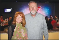  ?? (NWA Democrat-Gazette/Carin Schoppmeye­r) ?? Jennifer and Tom Stallbaume­r stand for a photo at the food bank benefit.