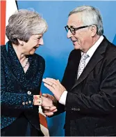  ?? EMMANUEL DUNAND/GETTY-AFP ?? EU’s President Jean-Claude Juncker greets Britain’s Theresa May, who must now sell a Brexit deal to Parliament.