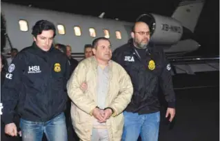  ??  ?? RONKONKOMA, New York: US law enforcemen­t authoritie­s escort Joaquin “El Chapo” Guzman from a plane to a waiting caravan of SUVs at Long Island MacArthur Airport on Thursday. — AP