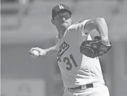  ?? JOHN MCCOY/AP ?? Dodgers starting pitcher Max Scherzer throws against the Padres on Sunday in Los Angeles. Scherzer notched his 3,000th career strikeout in the fifth inning of the game.