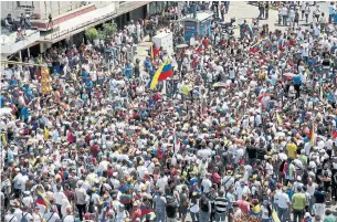  ?? EDILZON GAMEZ GETTY IMAGES ?? Venezuelan­s take part in a protest against the government of Nicolas Maduro on Saturday. Opposition leaders have staged rallies for weeks in an attempt to dislodge the president.