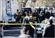  ?? RICARDO B. BRAZZIELL — AUSTIN AMERICAN-STATESMAN VIA AP ?? Authoritie­s work on the scene of an explosion in Austin on Monday. Two package bomb blasts a few miles apart killed a teenager and wounded two women in Austin on Monday.