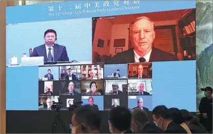  ?? ZOU HONG / CHINA DAILY ?? Song Tao (left), minister of the Internatio­nal Department of the Communist Party of China Central Committee, and Howard Dean, former head of the Democratic National Committee, take part in the 12th China-US Political Party Leaders Dialogue, which was held via video link in Beijing on Sept 13.